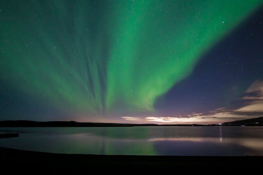 Aurora reflecting on Hafravatn lake near Reykjavik