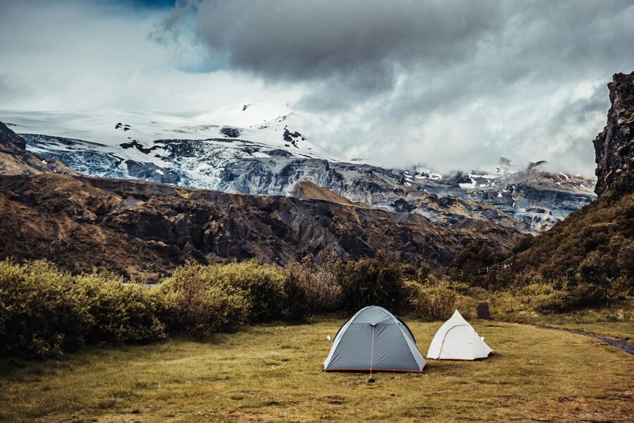 Two tents at Iceland highland campsite with glaciers