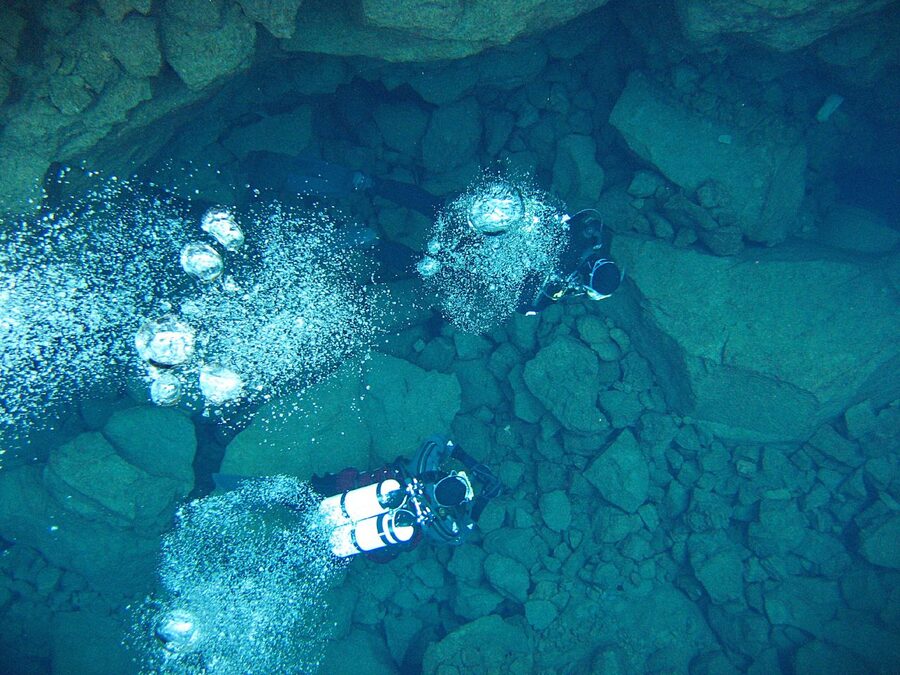 Snorkellers floating overhead in the Silfra fissure
