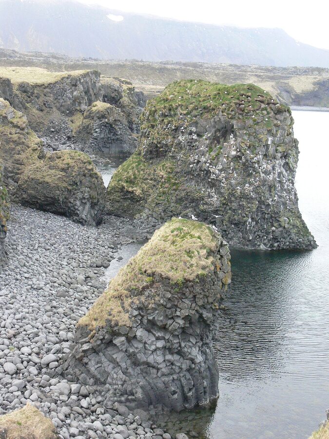 Coastal cliffs and basalt formations near Arnarstapi village on Snaefellsnes
