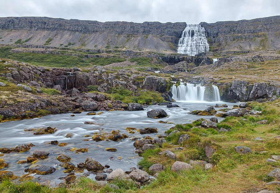 Dynjandi waterfall cascading down rocky cliff in Westfjords Iceland