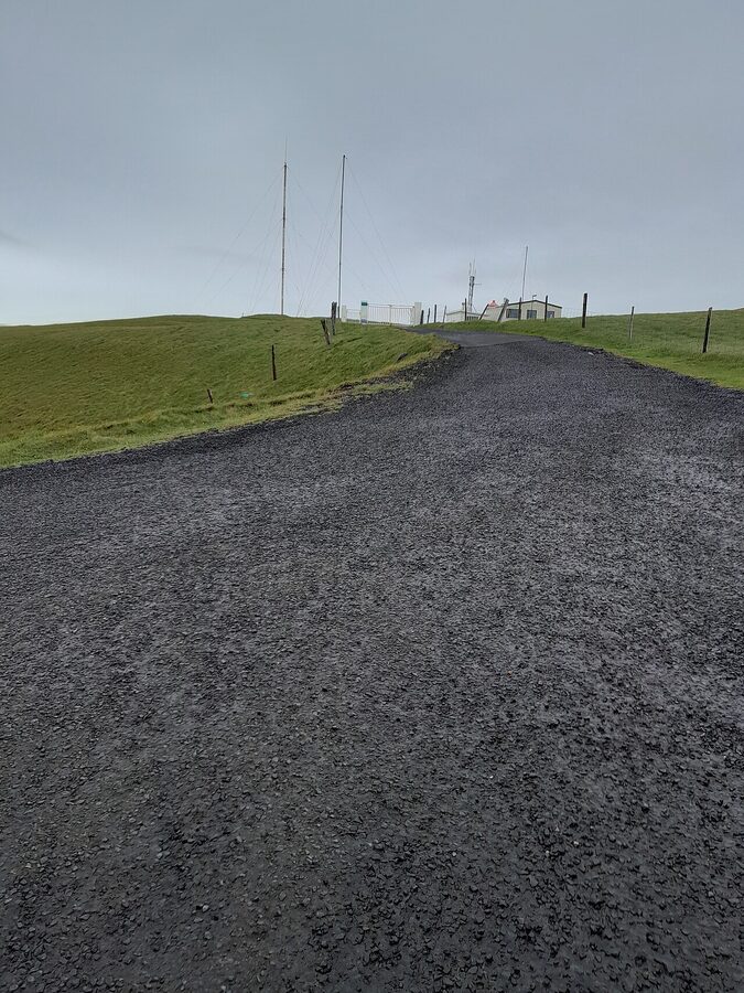 Heimaey town and harbour from above on a summer morning