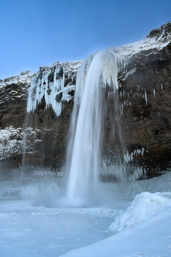 Seljalandsfoss waterfall in winter with snow