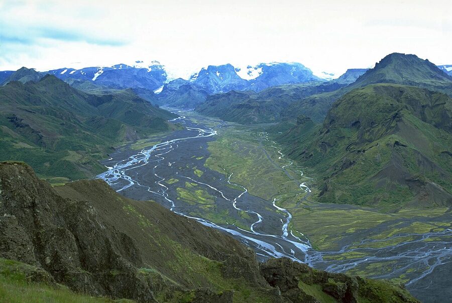 Thorsmork green river valley with glaciers in the background