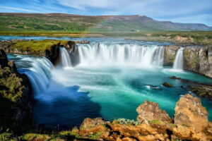 Akureyri Port: Myvatn Nature Baths & Godafoss Waterfall Tour - Goðafoss waterfall: crescent curves and Christianization lore