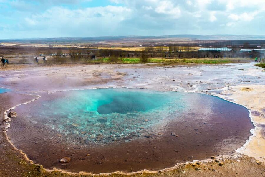 From Reykjavik: Golden Circle and Secret Lagoon Day Tour - Geysir Geothermal Fields: Mud Pits, Bubbling Springs, and Strokkur