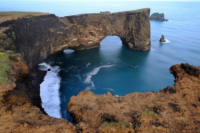 Glacier Lagoon, Diamond Beach, Black Sand Beaches and Waterfalls - Dyrhólaey: Volcanic Shape and a Promontory Look Toward Vík