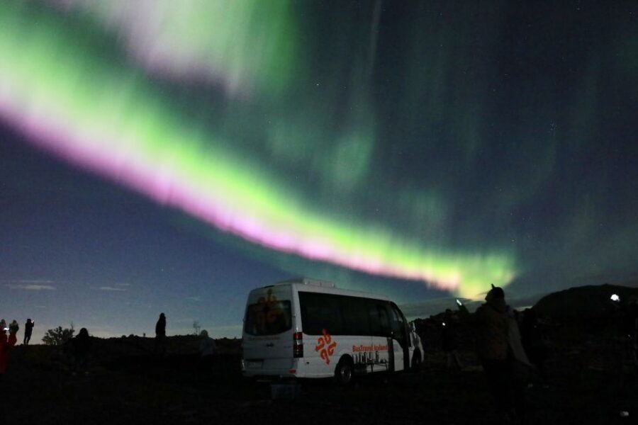 Reykjavik: Northern Lights Group Tour with Photos - Choosing the right darkness: forecasts, multiple stops, and why conditions matter