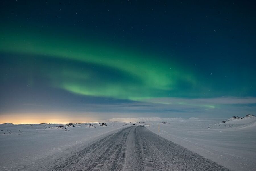 Reykjavík: Northern Lights Minibus Tour with Photos - Chasing Clear Skies: How the Guide Plans the Hunt