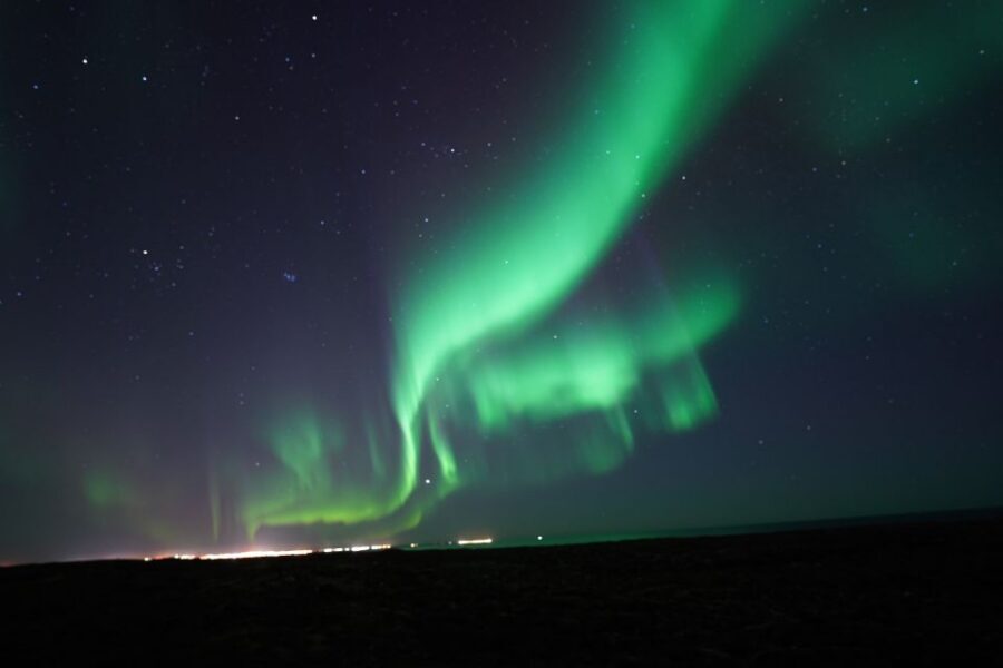 Reykjavik: Premium Northern Lights Tour with Free Photos - The Guide Experience: Warm Facts, Humor, and Patient Spotting