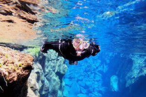 Silfra Drysuit Snorkeling with Free Photos - Meet on Location - Dry suit snorkeling setup: the gearing line is part of the adventure